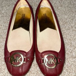 Michael Kors flats size 7 1/2 burgundy in color
